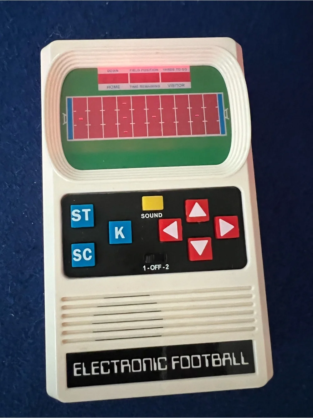Mattel Electronic Football Handheld Game in White with Red and Blue Buttons